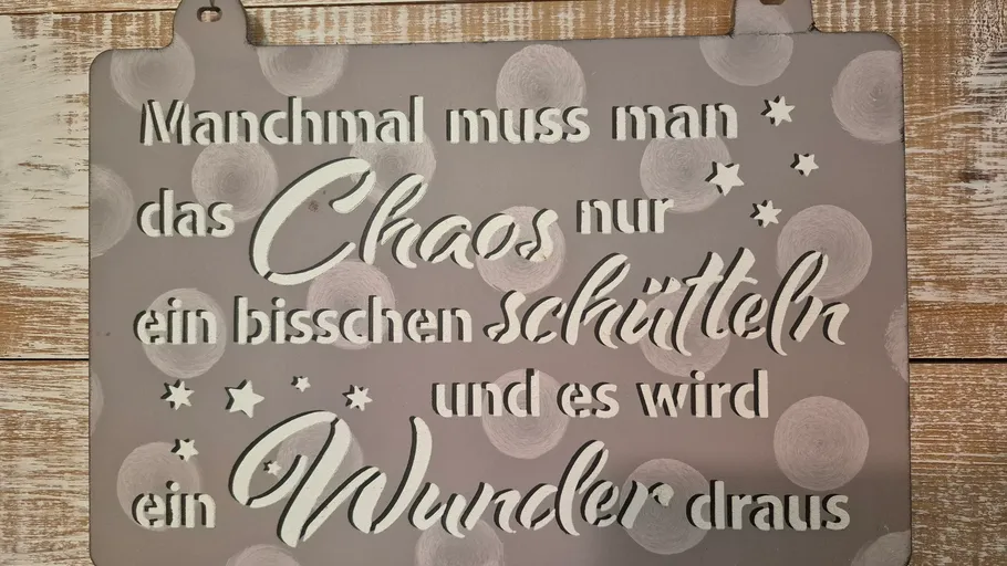 Decorative plaque with German inspirational text.