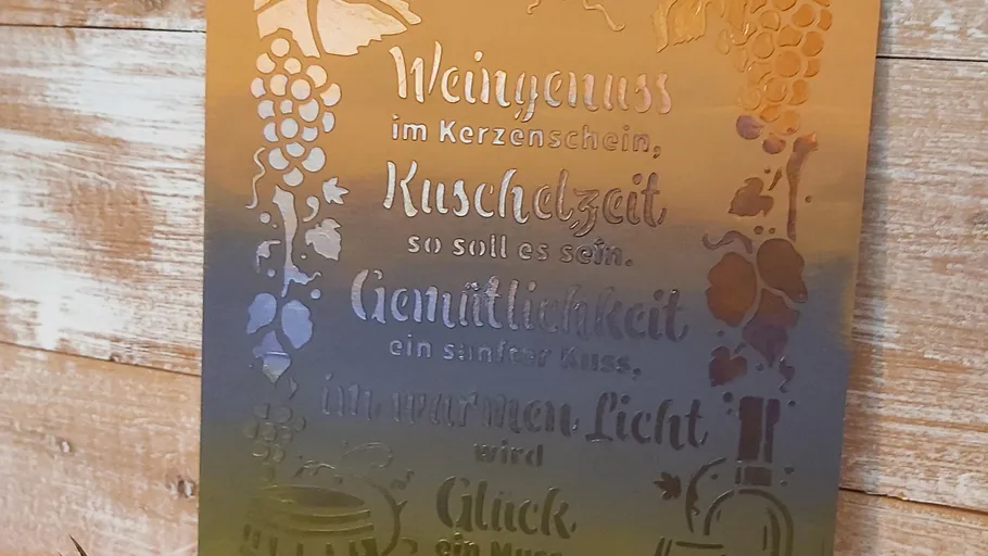 Metal plaque with decorative German text.