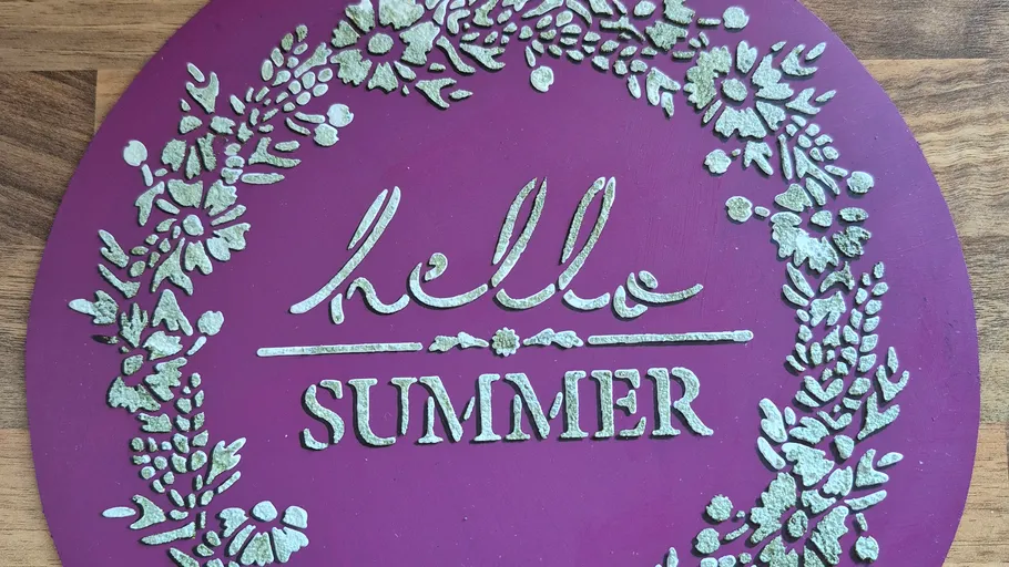Purple sign with 'hello SUMMER' and floral design.
