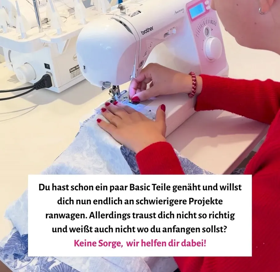 Person sewing on a white sewing machine.