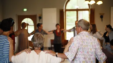 Group dancing in a cozy room.