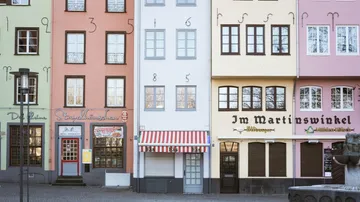 Colorful row of buildings with large numbers.