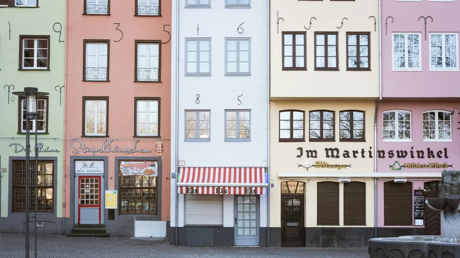 Colorful row of buildings with large numbers.