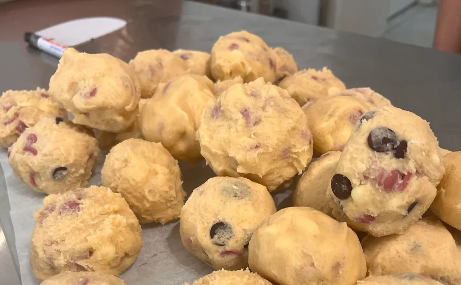 Cookie dough balls on a baking tray.