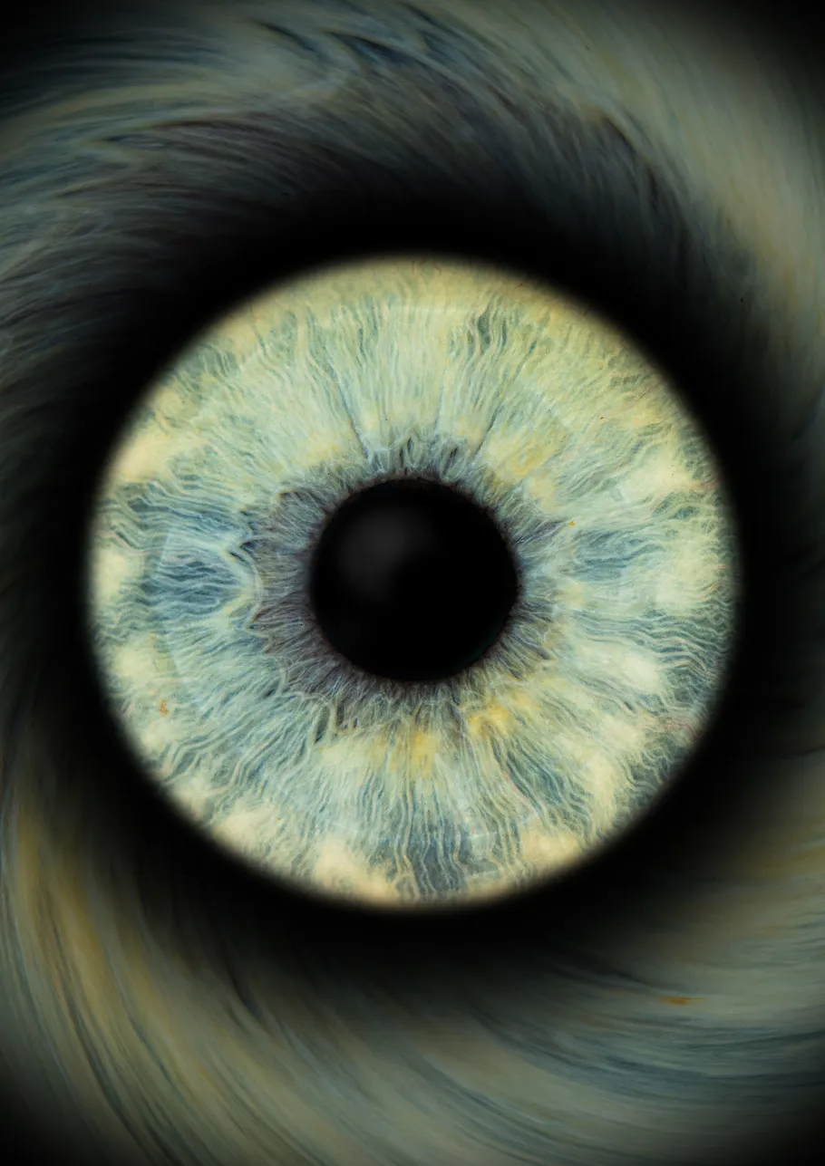 Blue eye close-up with detailed iris pattern.