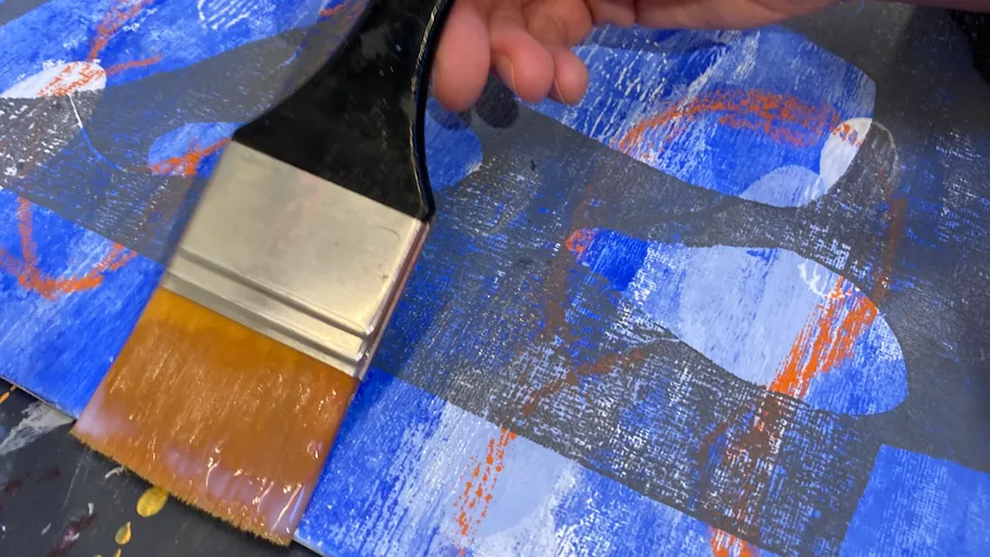 Hand painting abstract art with large brush.