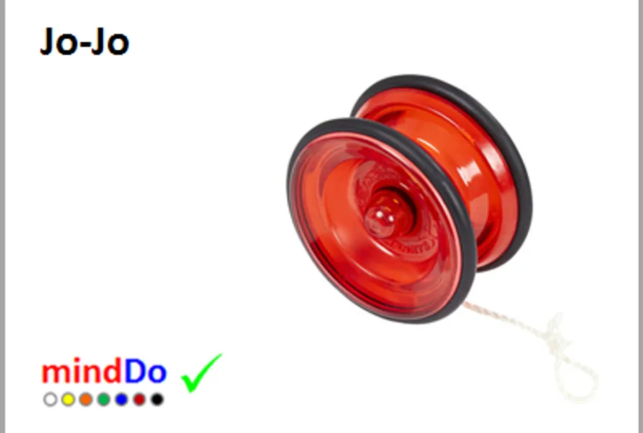 Red yo-yo with string on white background.