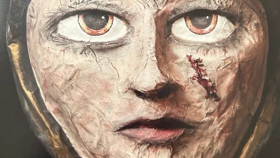 Sculpted face with intense eyes, scarred cheek.