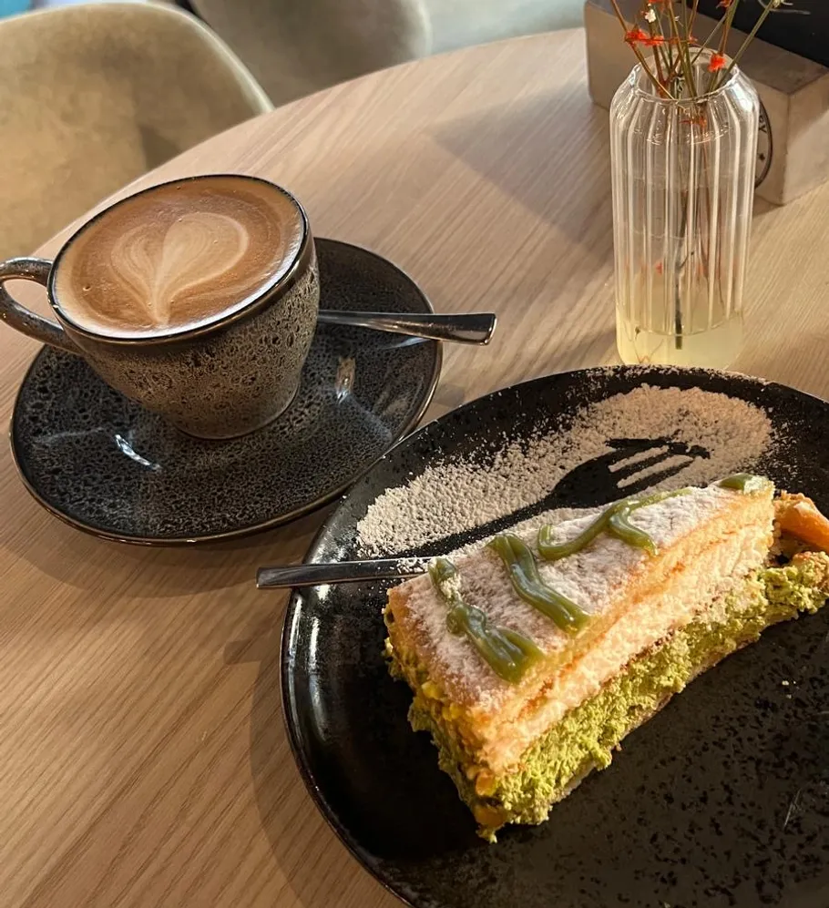 Coffee and cake on a wooden table.