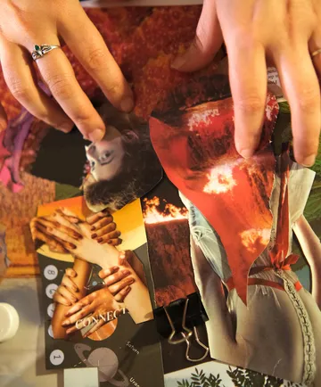 Hands arranging collage of magazine cutouts.