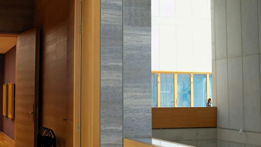 Open door in modern building hallway.