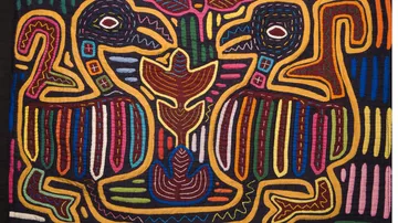 Colorful textile features two abstract bird designs.