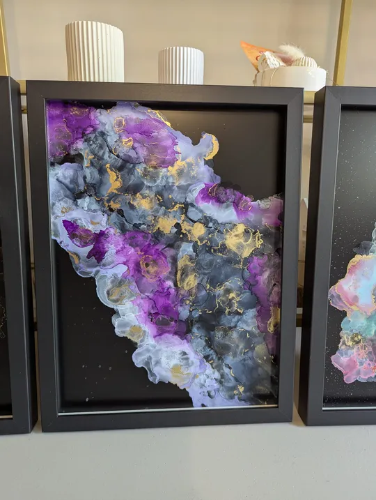 Abstract painting with purple, white, gold streaks.