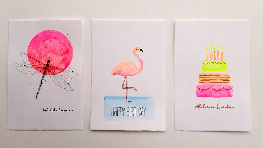 Three greeting cards with colorful designs displayed.