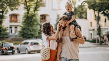 Family walking together in a city street.