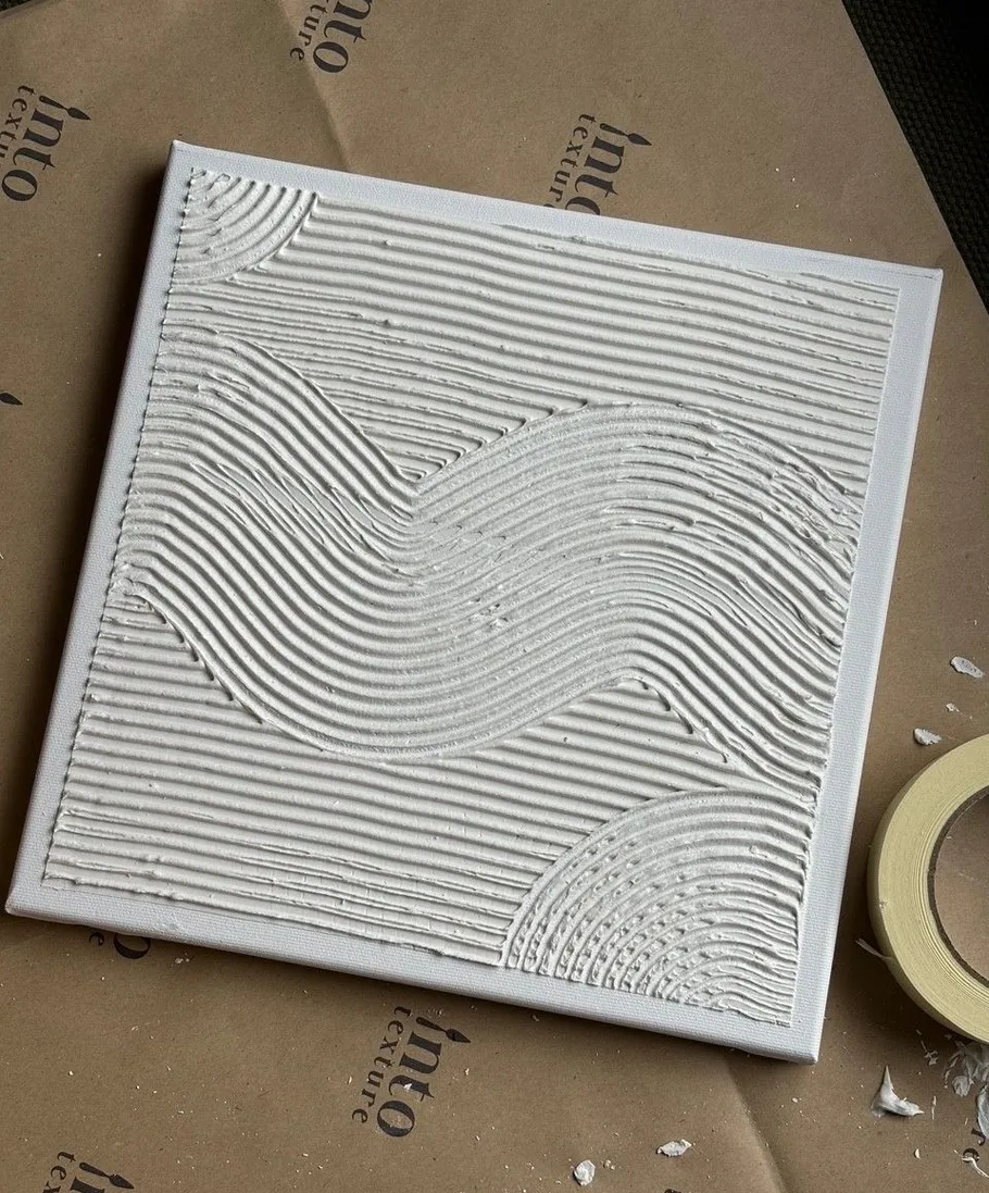Textured artwork with wavy patterns on canvas.