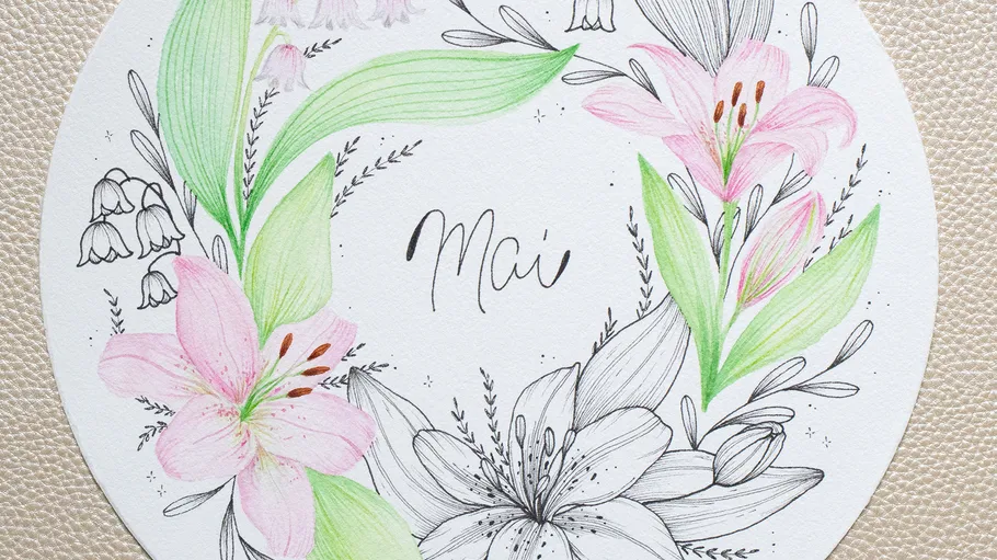 Circle with flowers and 'Mai' text in center.