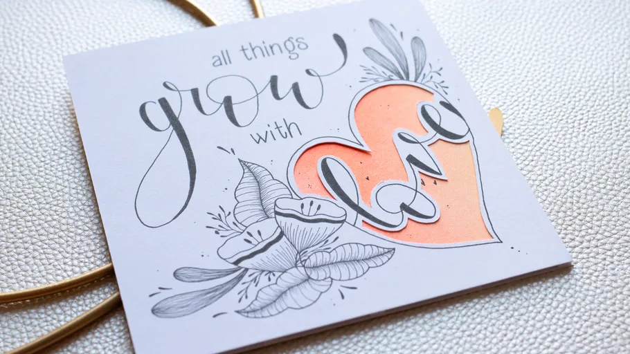 Greeting card with floral design and heart.