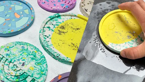Colorful coasters on a table; hand holding one.