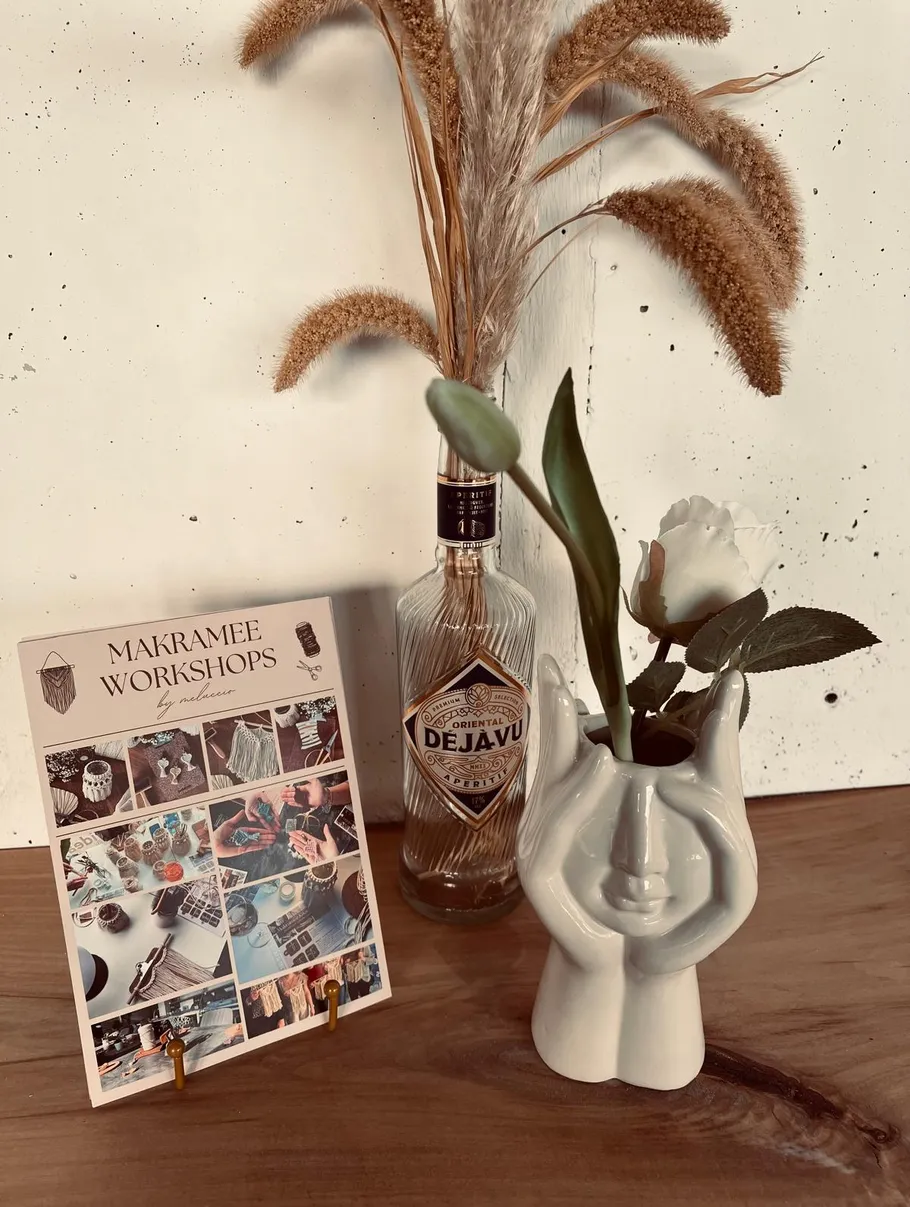 Decorative items on table with workshop flyer.