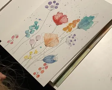 Aquarellblumen auf Papier gemalt.