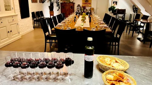 Table set for dinner with wine glasses.