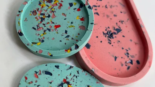 Colorful terrazzo coasters on white surface.