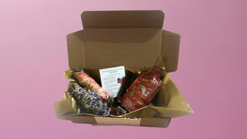 Open gift box with incense and products.