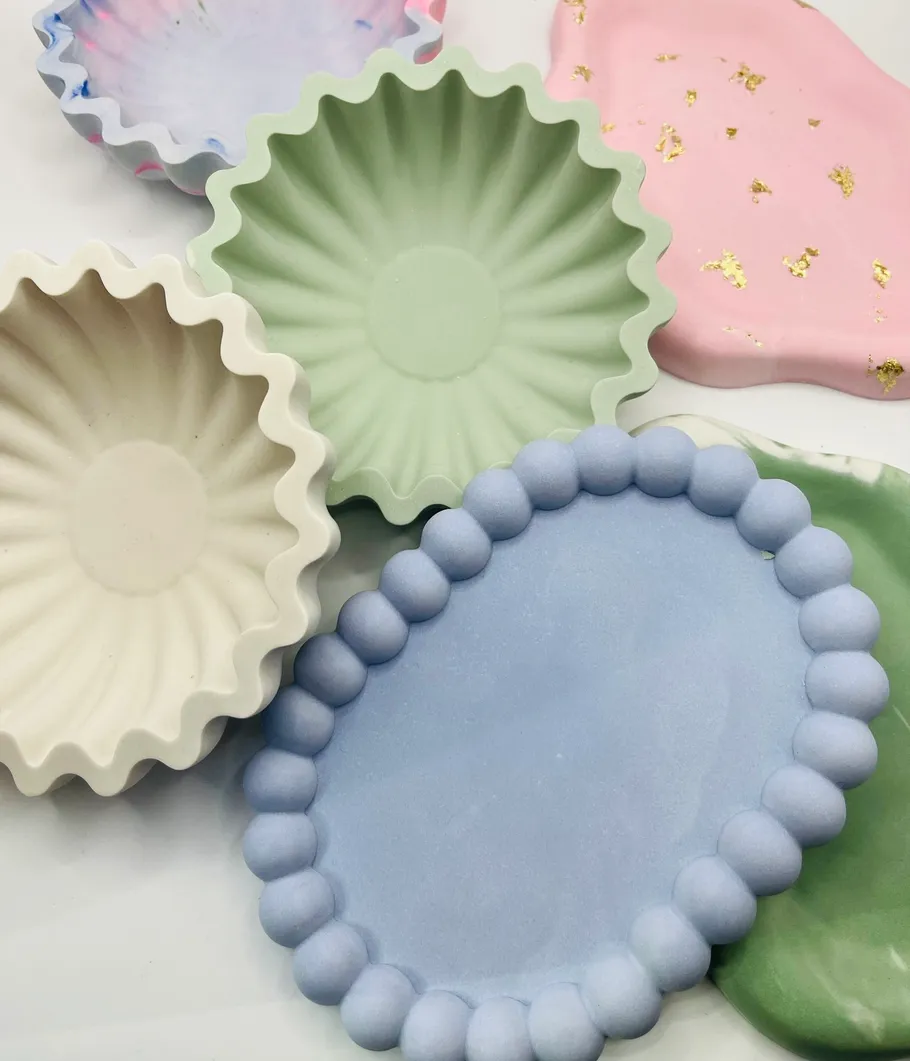 Colorful decorative plates arranged on a surface.