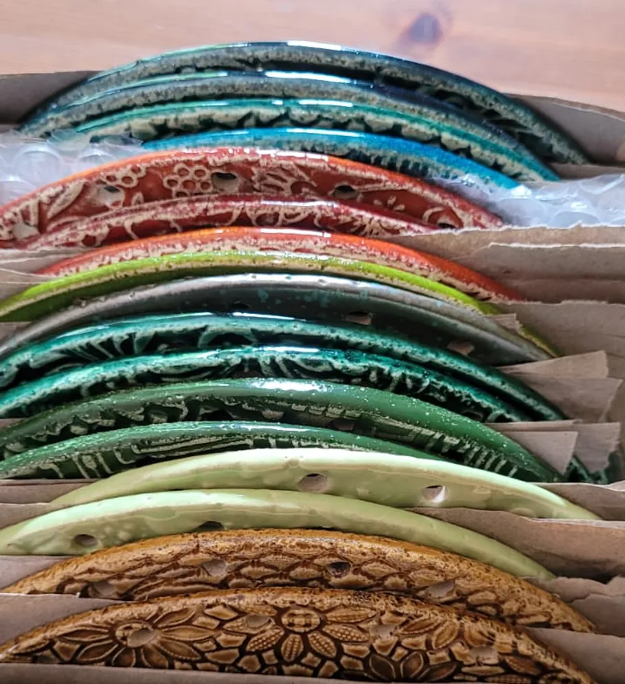 Colorful ceramic discs stacked together.