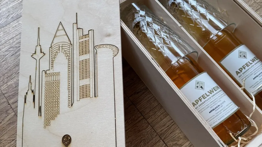 Wooden box with two cider bottles inside.