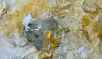 Abstract gold and white textured painting.