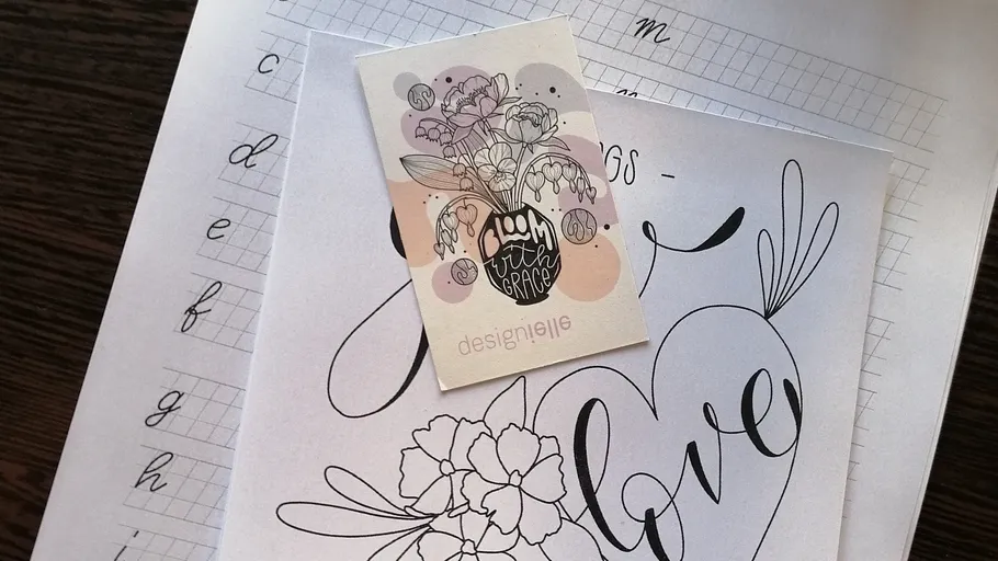 Card on calligraphy sheets, artistic design.