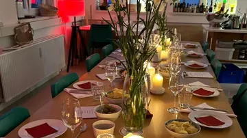 Decorated dining table with candles and flowers.