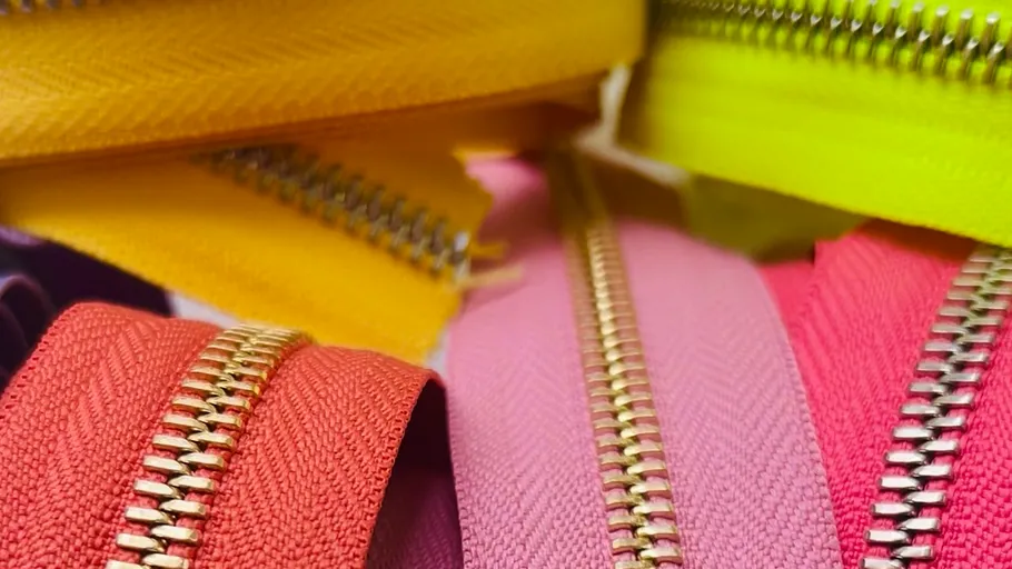 Colorful zippers in close-up view.