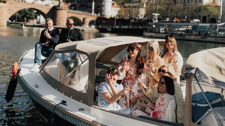 Group enjoying drinks on a boat ride.