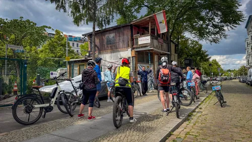 Cyclists gather at a street corner.