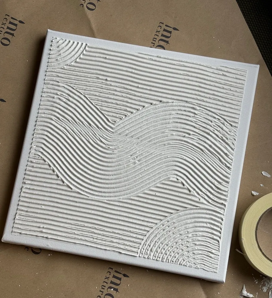 Textured white canvas with wavy pattern.
