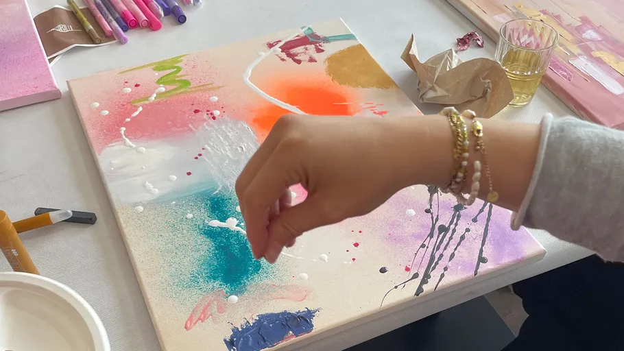Hand painting on colorful abstract canvas.