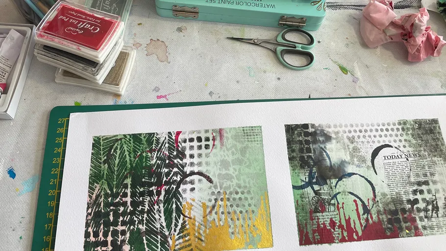 Art supplies on table with printed designs.