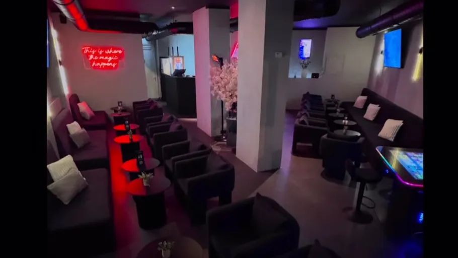 Modern lounge seating in dimly-lit club.