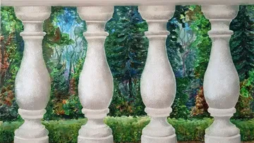 White balusters overlooking lush green forest.