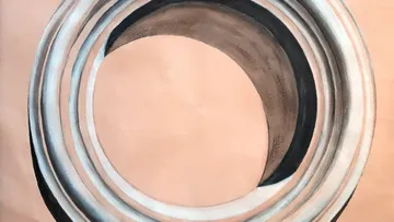 Circular abstract art with gradient shades.