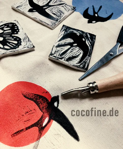 Linocut carvings, tools on printed fabric.