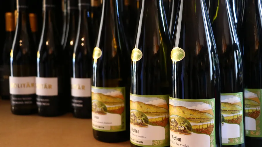 Wine bottles on display in a store.