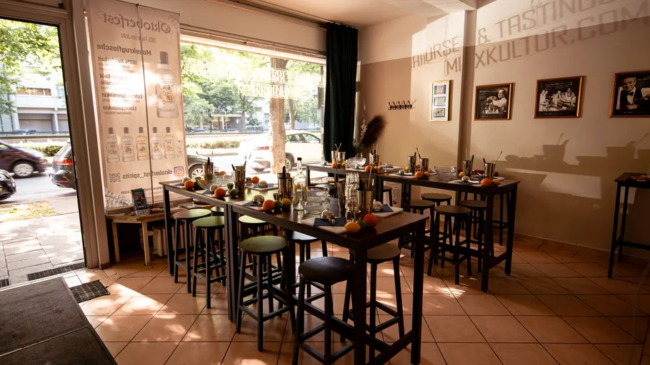 Bar area with stools and cocktail tools.
