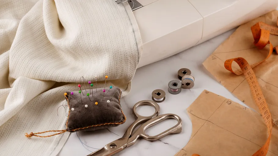 Sewing machine with fabric, patterns, and tools.