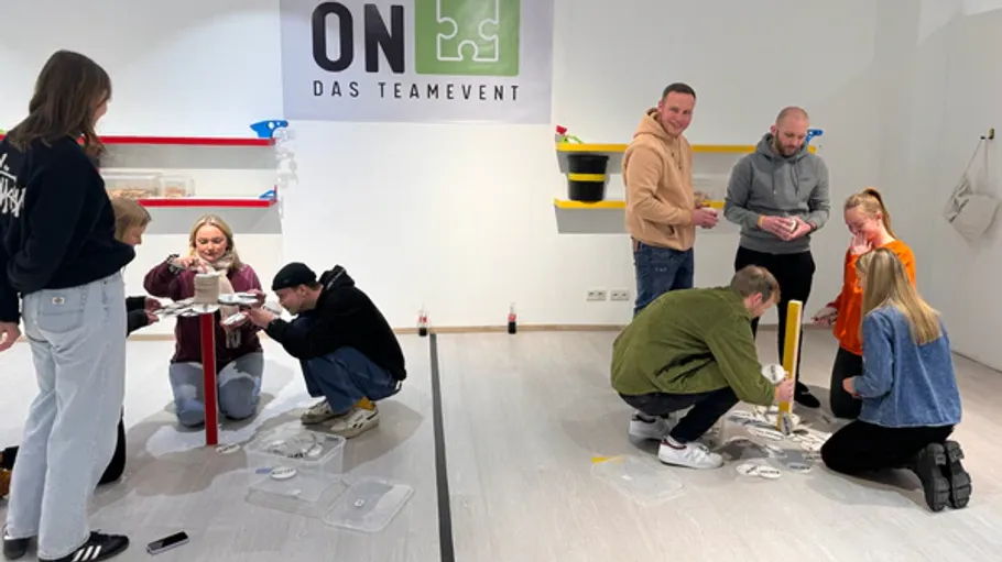 People engaging in a team-building activity indoors.