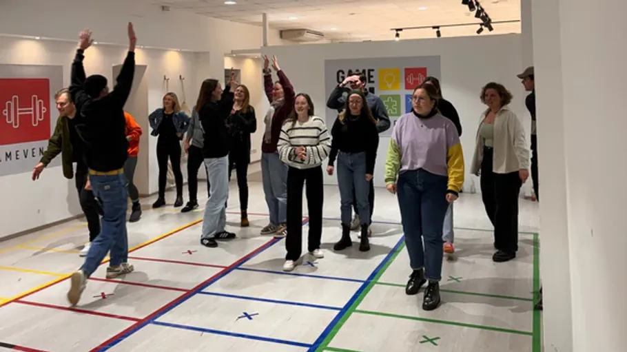 Group of people playing a game indoors.