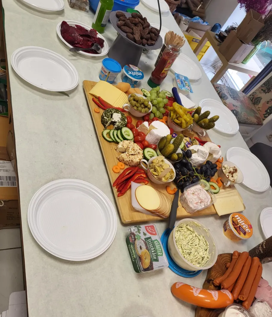Variety of foods on table with plates.